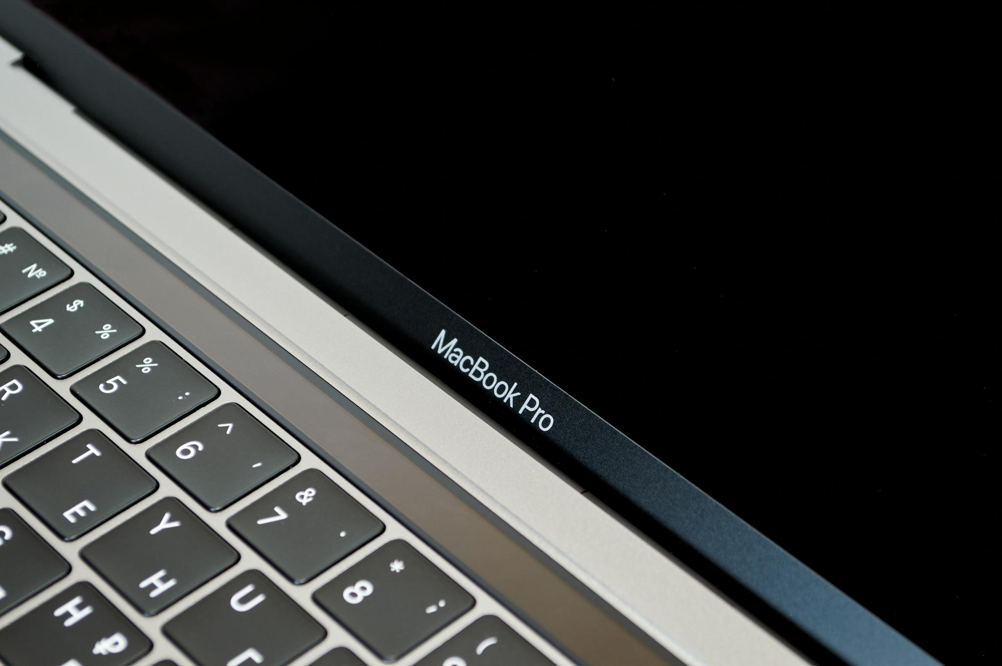 Detailed image showcasing the keyboard and screen of a MacBook Pro laptop for tech and gadget enthusiasts.